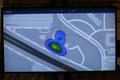 Photograph: [A monitor showing blue-purple spots on a map of UNT]