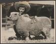 Photograph: [A girl with her prize-winning sheep]