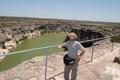 Photograph: [Man standing at the overlook of the Pecos River]