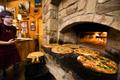 Photograph: [Ancient Ovens: Where Wood-Fired Pizza Creates Culinary Magic in Sain…