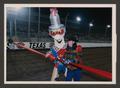Primary view of [Tina Richey and mascot Sparky cutting a ribbon]