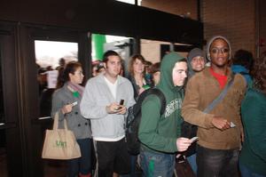 Primary view of object titled '[Students Entering UNT Coliseum Front Entrance]'.