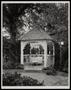 Photograph: [A table and seating in a gazebo]