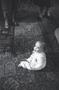 Photograph: [A baby sitting in a living room, 1]