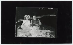 Primary view of object titled '[Couple Making Sop Sticks]'.