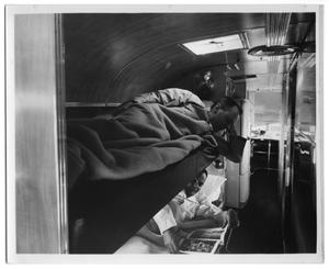 Primary view of object titled '[A Long View Inside the Bus, With Sleeping Quarters and Kitchenette]'.