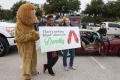 Photograph: [Dorothy Bland with sign at homecoming parade]