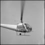Photograph: [Joe Clark in a helicopter]