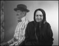 Photograph: [Blurry photograph of a man and woman sitting together]