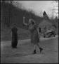 Photograph: [Student and teacher playing horseshoes(2)]