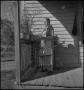 Photograph: [Woman on the porch]