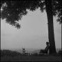 Photograph: [Photograph of a man relaxing under a tree, 1]