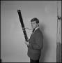 Photograph: [UNT band tour member holding a bassoon, 7]