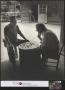 Photograph: [Two men playing checkers]