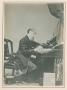 Photograph: [Photograph of Charles Dickens writing at desk]