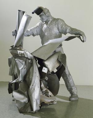 Primary view of object titled 'John Chamberlain Working'.