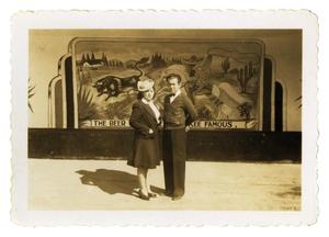 Primary view of object titled '[Couple in front of mural]'.