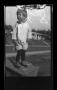 Photograph: [Charles Williams standing on a box]