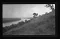 Photograph: [River next to a hill]