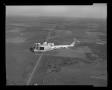 Primary view of [XH-40 #3 flying over the Hurst plant]
