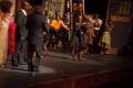 Photograph: [Blurry Photograph of Performers on Stage]