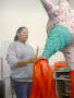 Photograph: [Woman creating a piñata]