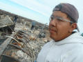 Photograph: [Man surveying fire damage]