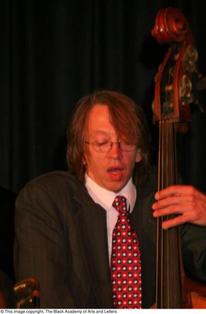 Primary view of object titled '[Bassist playing on stage]'.