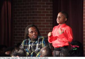 [Curtis King on Stage with Young Performer]