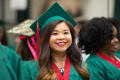 Photograph: [Undergraduate Student Smiling for Photo at Commencement Ceremony]