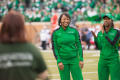 Photograph: [Women's Basketball Head Coach and player at Homecoming football game]