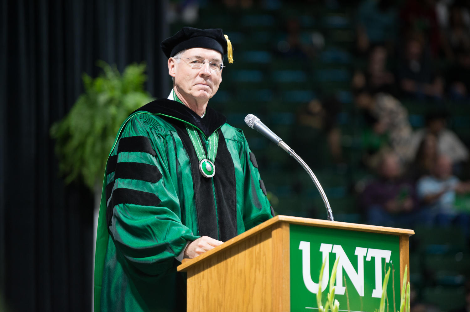 [Faculty Member Standing At Podium During Commencement Ceremony]
                                                
                                                    [Sequence #]: 1 of 1
                                                