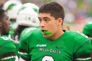 [Mason Fine on sidelines during UNT Homecoming game]