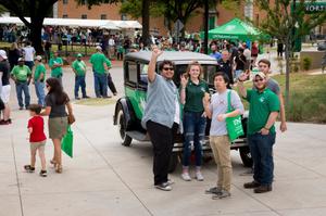 Primary view of object titled '[Students stand in front of Mean Green Machine]'.