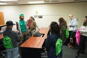 [UNT student staff talking with visitors during Preview Day]