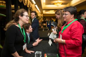 [Julia Flynn Siler speaking with conference attendee]