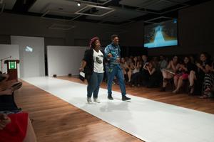 Primary view of object titled '[Fashion design student walking with model]'.