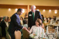 Photograph: [John McCaa greeting UNT Provost Finley Graves and wife Gail Graves]