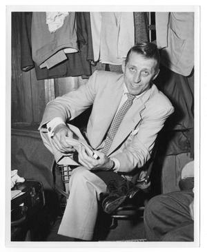 Primary view of object titled '[Photograph of Stan Kenton Sitting in a Room]'.
