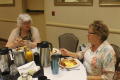 Photograph: [Attendees eating breakfast]