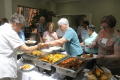 Photograph: [Attendees getting food from buffet 2]