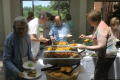 Photograph: [Attendees getting food from buffet 1]