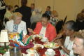 Photograph: [Attendees eating at banquet]