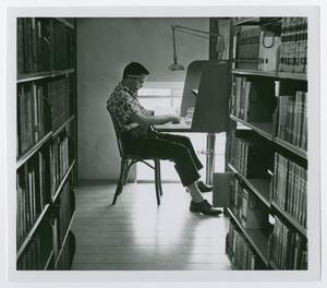 [Student in the stacks]