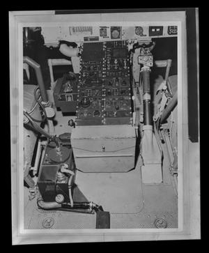[Photograph of controls in the cockpit of a UH-1B Iroquois helicopter]