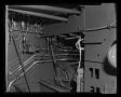 Photograph: [Photograph of a wiring and metal tubing inside a YUH-1D Iroquois hel…