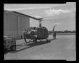 Photograph: [Photograph of a YUH-1D Iroquois helicopter on ground handling wheels]