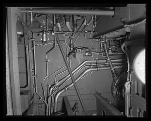 [Photograph of a wiring and metal tubing inside a YUH-1D Iroquois helicopter, 3]