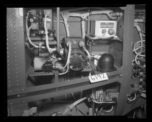 [Photograph of wiring inside a UH-1E helicopter]