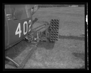 [Photograph of a side view of an armed UH-1B Iroquois helicopter]